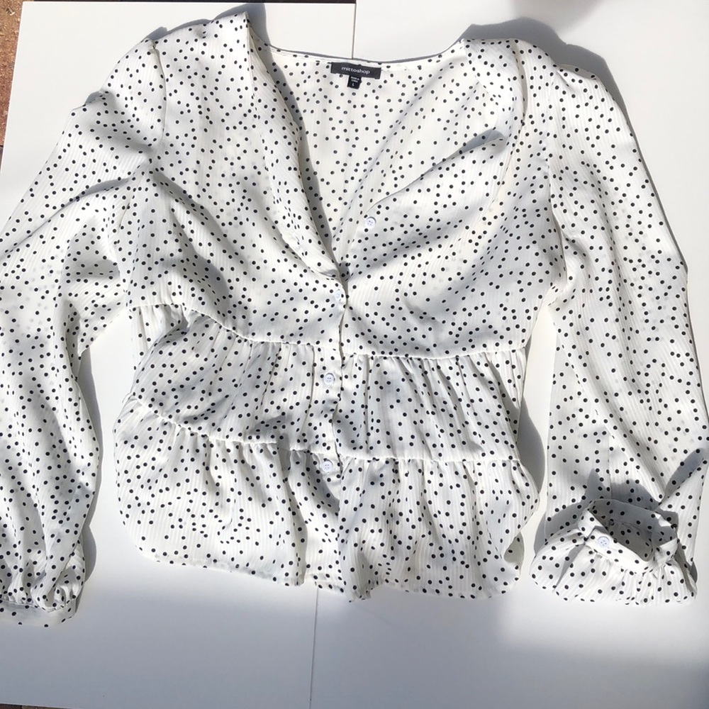 White and black polka dot blouse